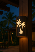 Load image into Gallery viewer, Decorative outdoor light with palm tree design on a wooden post at night.